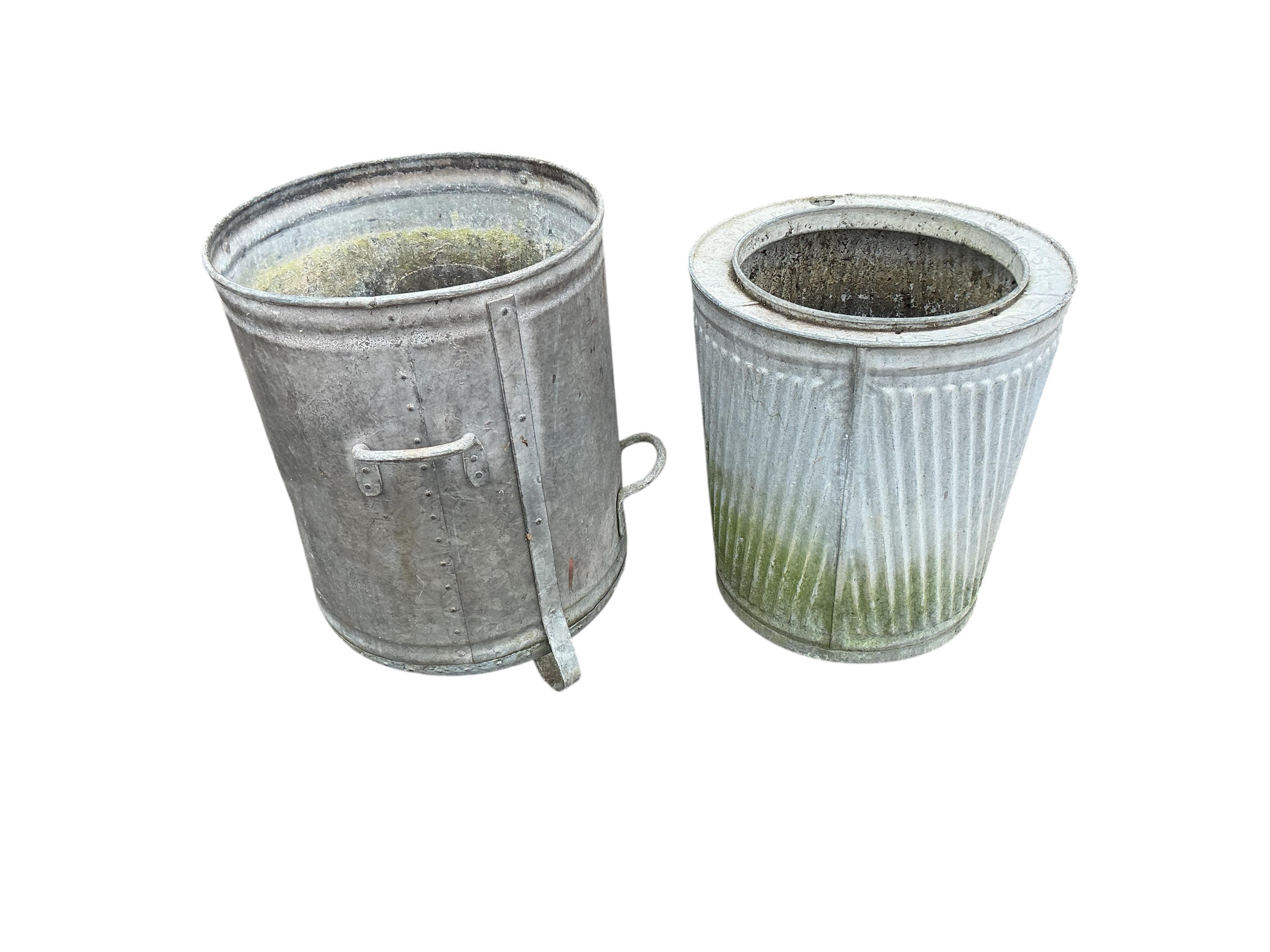 Two galvanised metal barrels, larger diameter 47cm, height 62cm